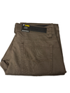 Folded brown pants with a label on a white surface